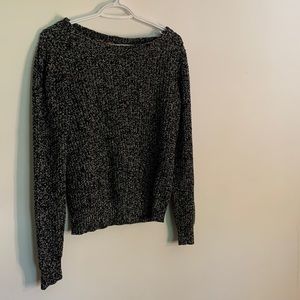 Out or tucked in black and white sweater